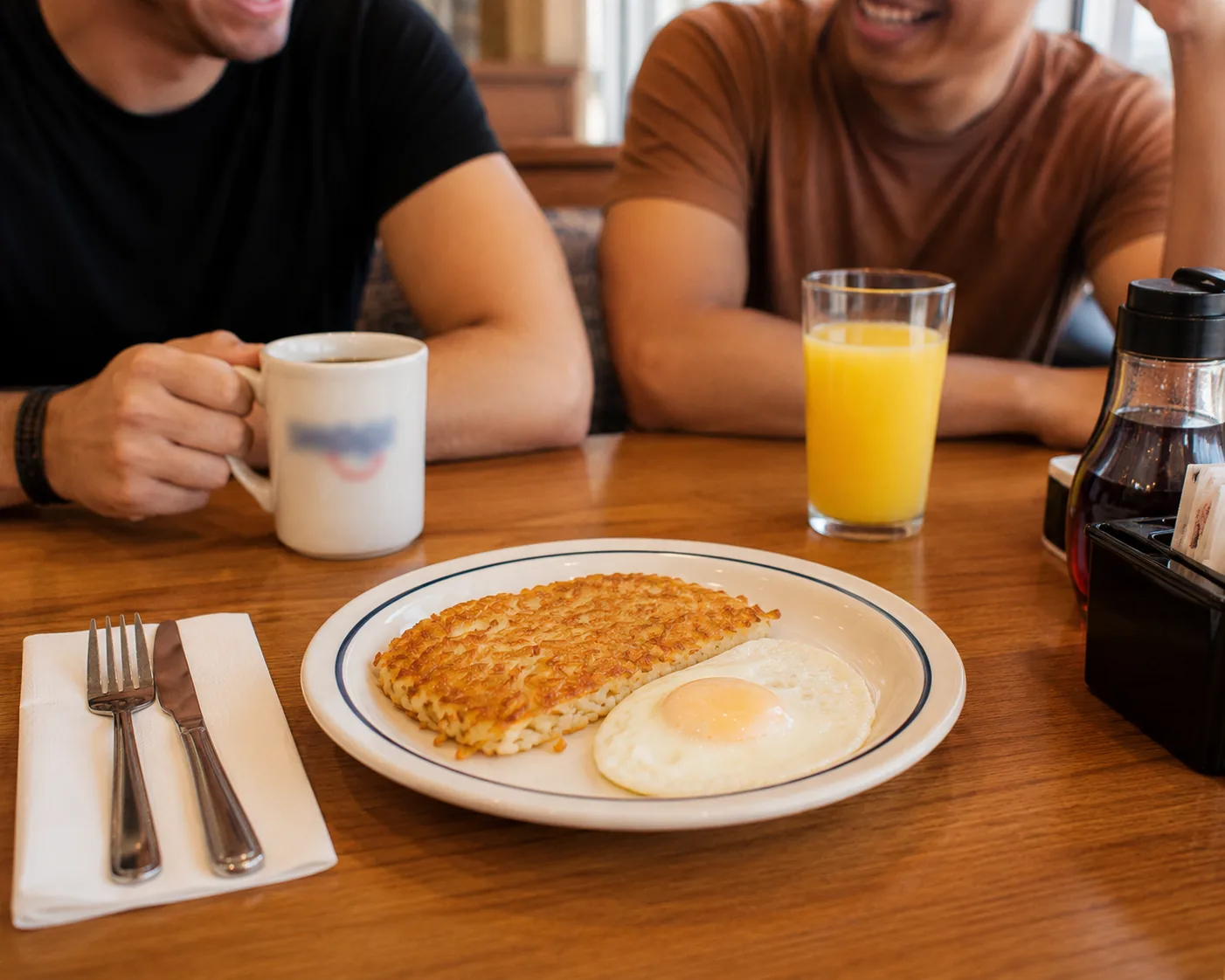 Simple small diner plate with hash browns and egg, related to the cheapest items on the IHOP menu