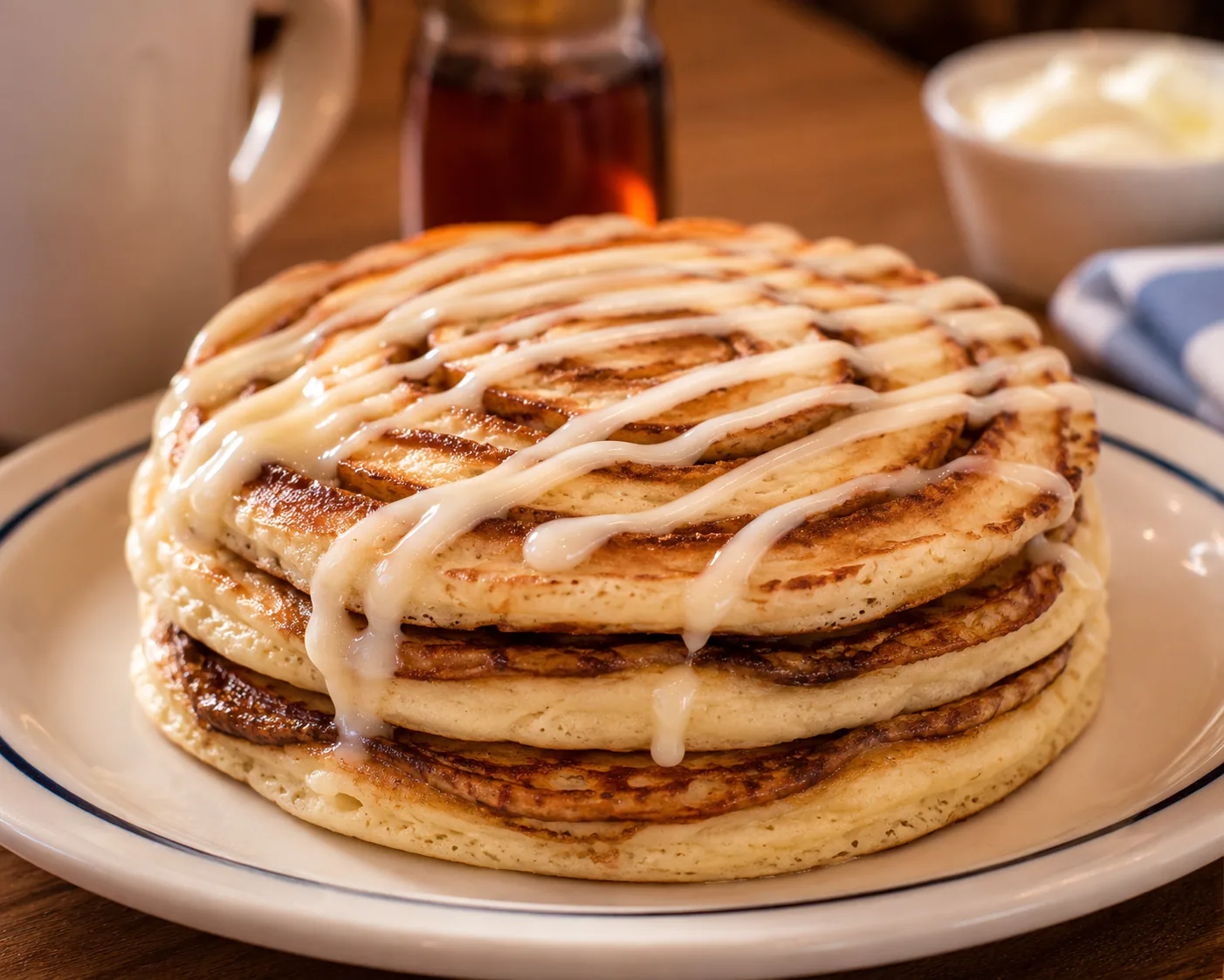 Pancakes with cinnamon filling and icing, related to IHOP's Cinn-A-Stack Pancakes