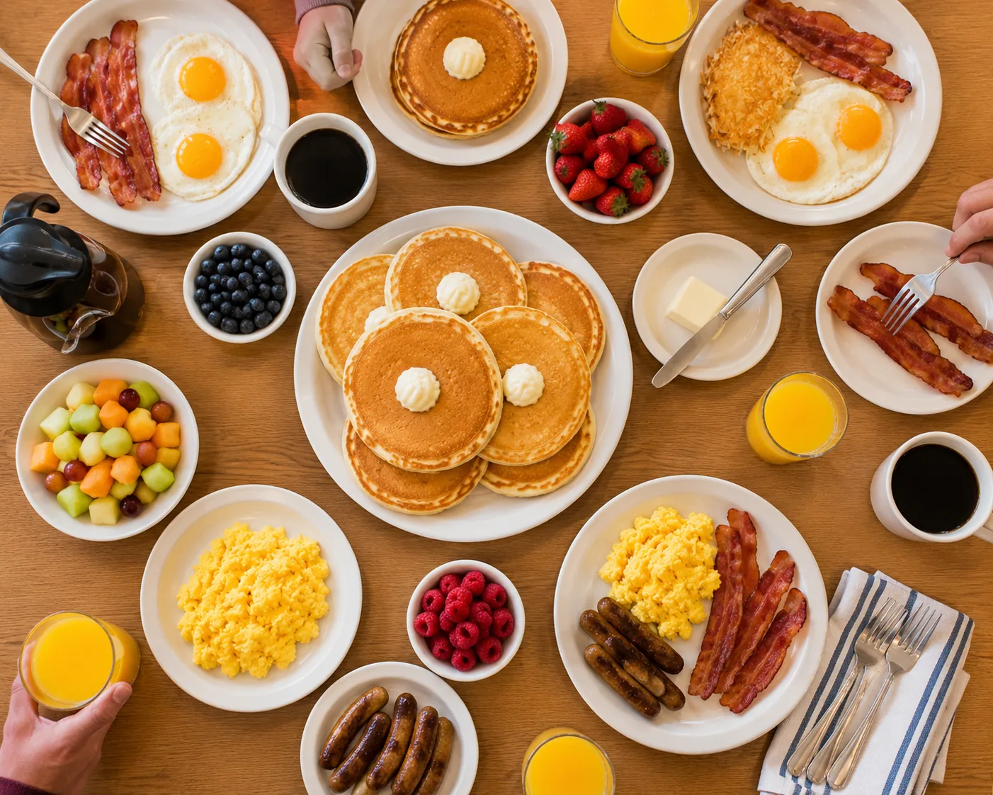 Family-style breakfast spread with pancakes and eggs, related to IHOP Family Feast prices
